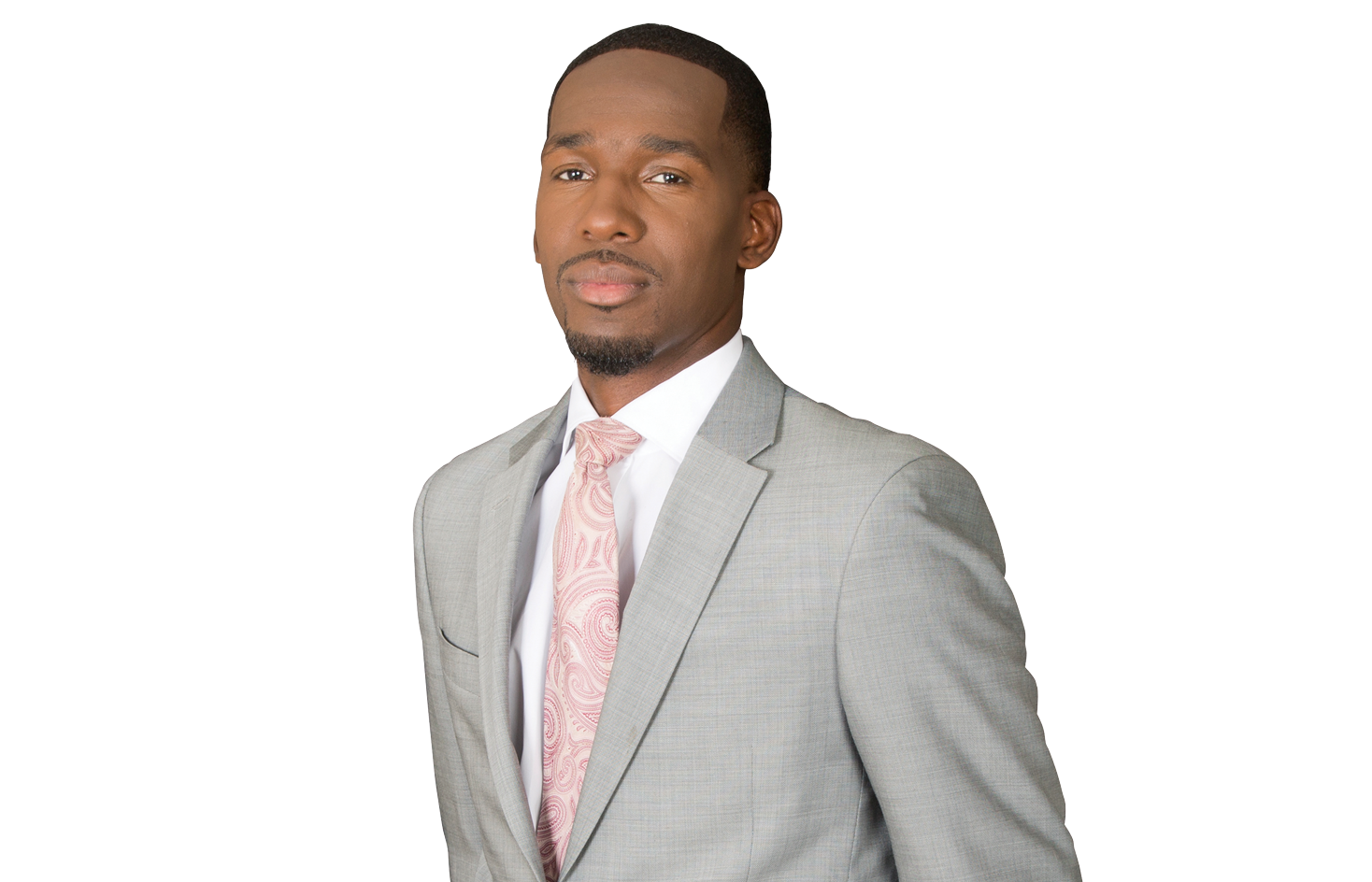 Business professional in a gray suit and pink tie on a white background, looking confidently ahead.