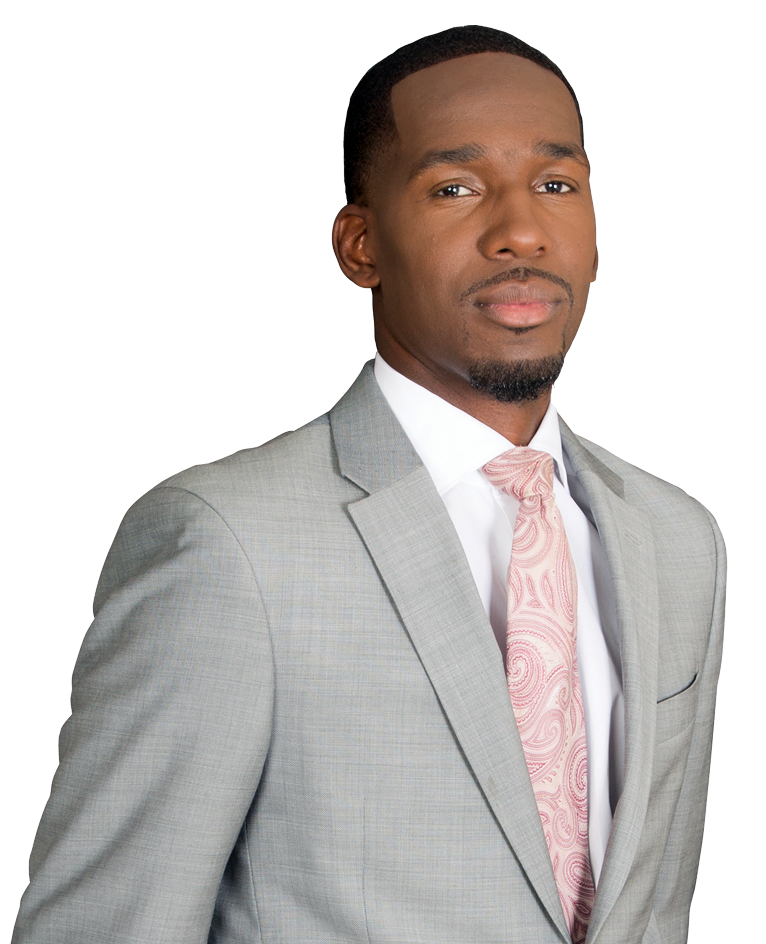 Professional man in a light gray suit with a pink tie, posing confidently against a white background.