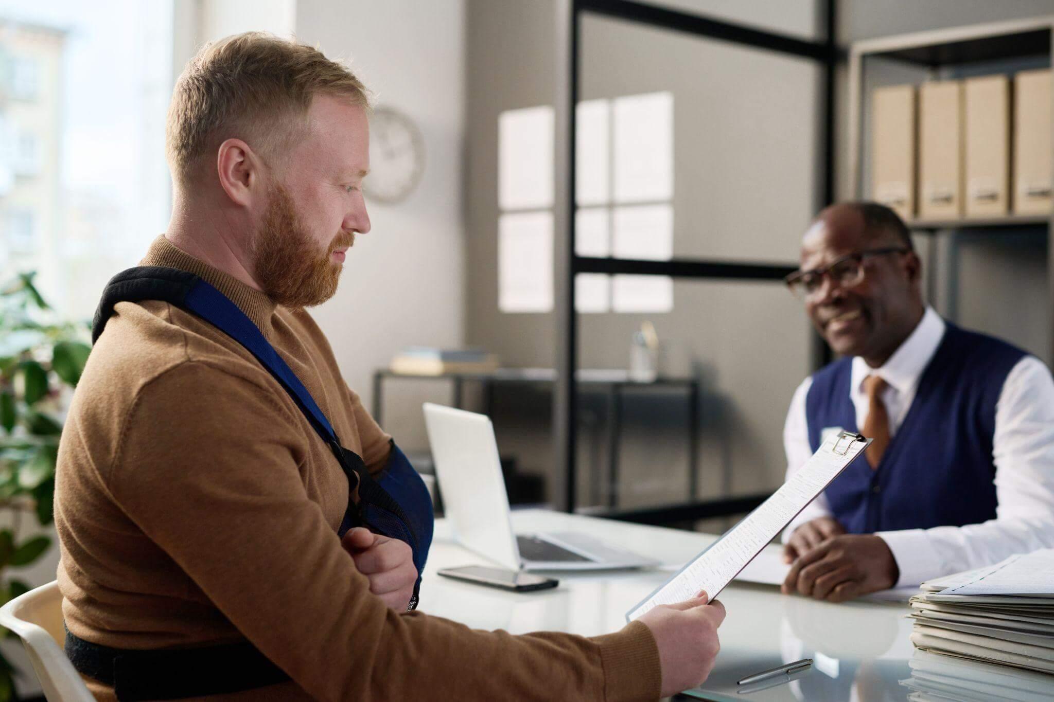 Two men reviewing legal papers, likely discussing a truck